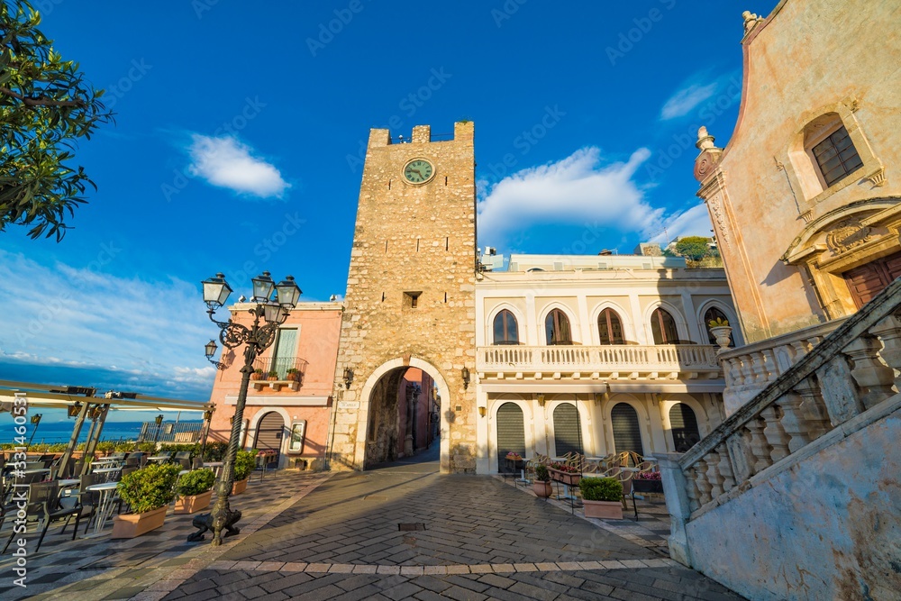 Empty Square Piazza IX Aprile with San Giuseppe church and Clock Tower in Taormina, Sicily, Italy.