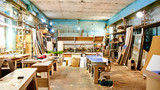 Interior carpentry workshop, equipment and tools for the manufacture and production of wooden furniture. DIY concept, craft