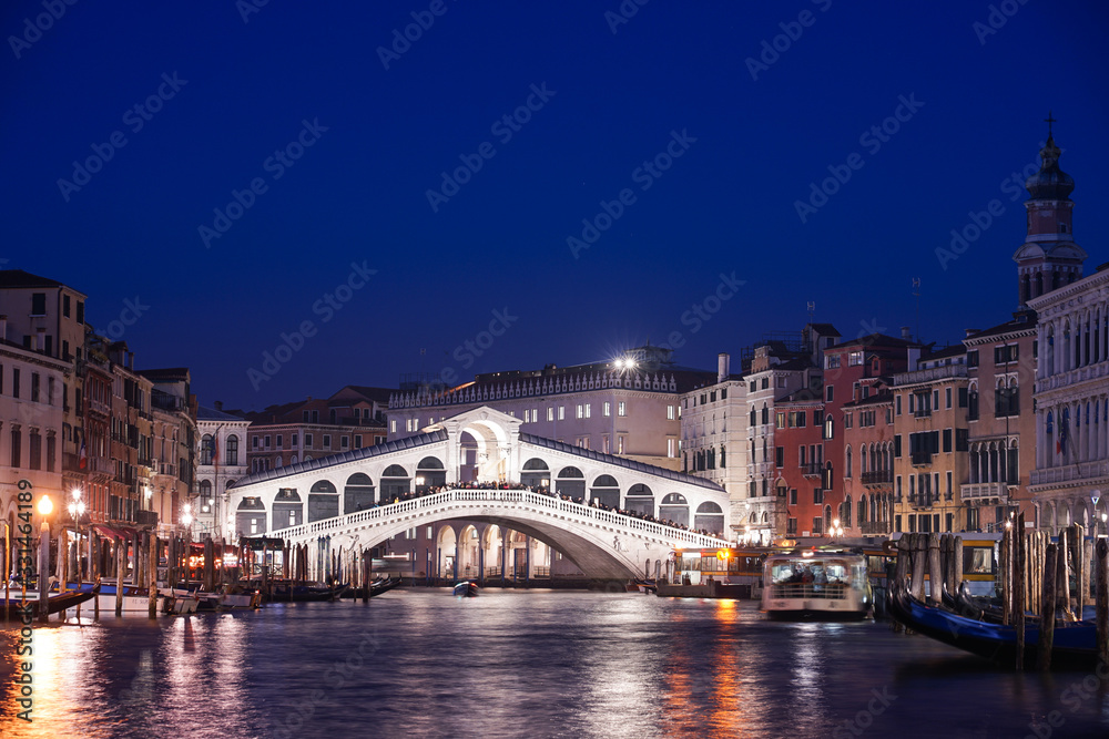 The famous Rialto bridge in Venice, Italy during the night