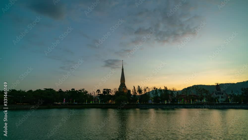 Timelapse Sunset or sunrise over Wat Chalong temple in Phuket island Beautiful light and reflex in the water Timelapse Sunset or sunrise over Wat Chalong temple in Phuket island Beautiful light and reflex in the water