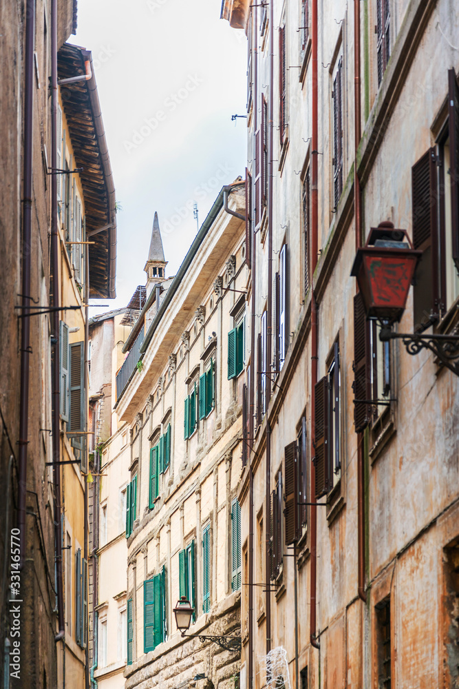 ROME, ITALY - January 17, 2019: Traditional street view of old buildings. is a city and special comune in Italy. With 2.9 million residents. Rome, ITALY ROME, ITALY - January 17, 2019: Traditional street view of old buildings. is a city and special comune in Italy. With 2.9 million residents. Rome, ITALY