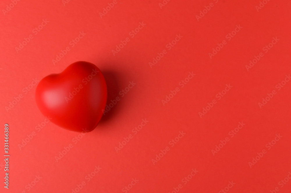 Fototapeta premium red heart on red background. Selective focus.