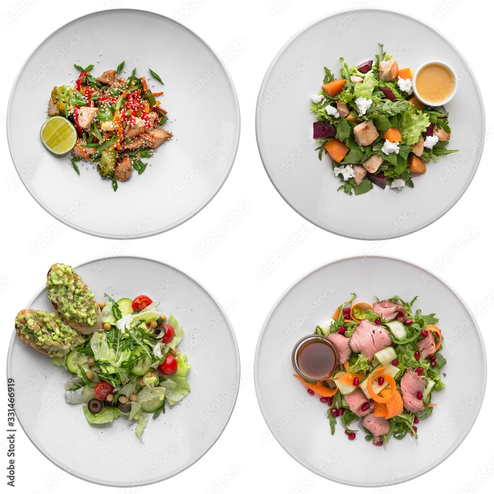 Set of several delicious meat salads with vegetables. Isolated on a white background. Set of several delicious meat salads with vegetables. Isolated on a white background.