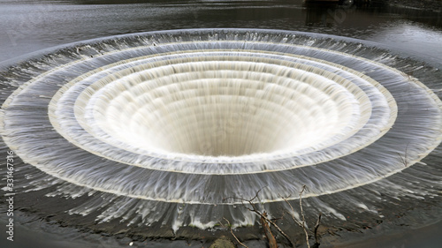 Tableau sur toile Slow shutter speed image of the Ladybower Reservoir overflow, Derbyshire