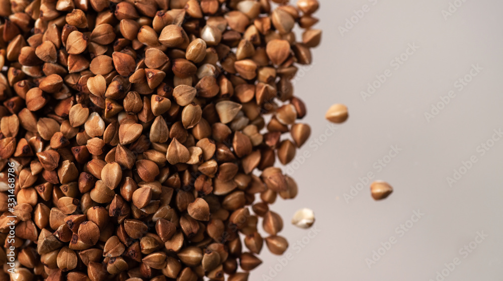 Obraz premium buckwheat. fresh buckwheat. dry buckwheat background. buckwheat texture with copyspace