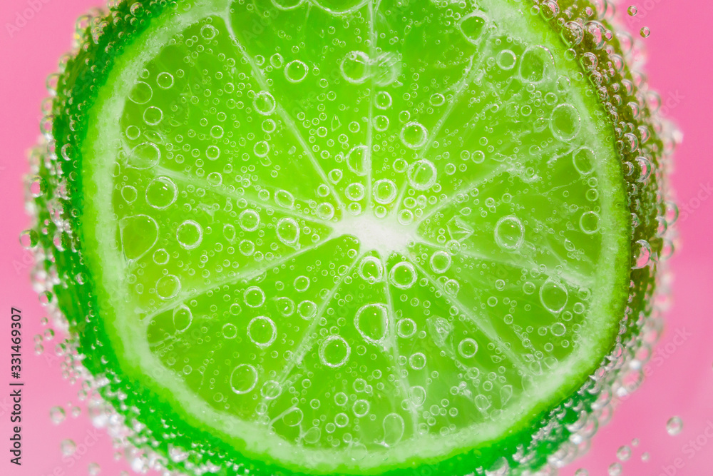 lime fruits in water under water with bubbles. juicy citrus close-up, macro. selective focus. lime fruits in water under water with bubbles. juicy citrus close-up, macro. selective focus.
