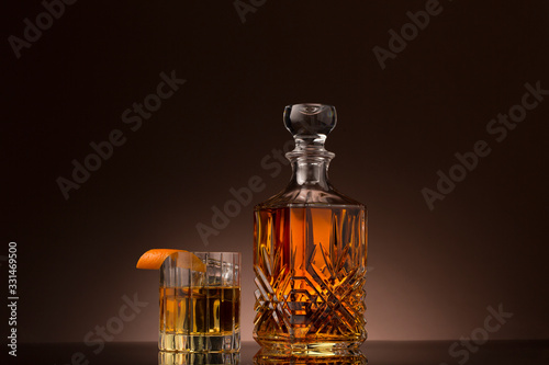 Tableau sur toile Whiskey old fashioned in crystal glass with decanter