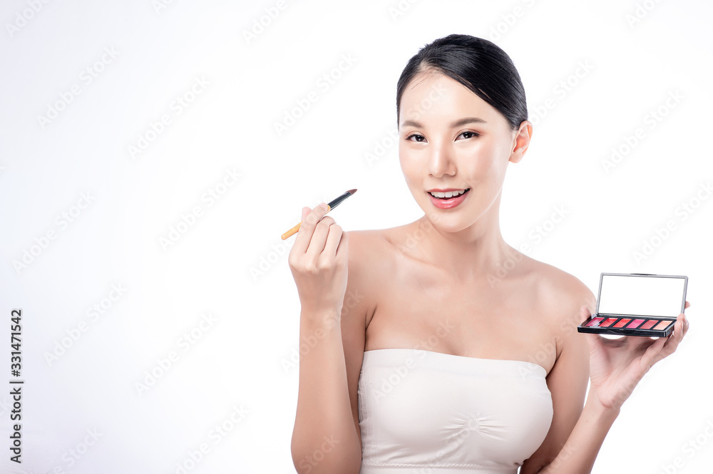 Asian woman poses for healthy skin beauty in white isolated background. Cosmetic, skincare, surgery concept with copy space. Her skin and face are healthy, beautiful, fresh and youthful. Asian woman poses for healthy skin beauty in white isolated background. Cosmetic, skincare, surgery concept with copy space. Her skin and face are healthy, beautiful, fresh and youthful.