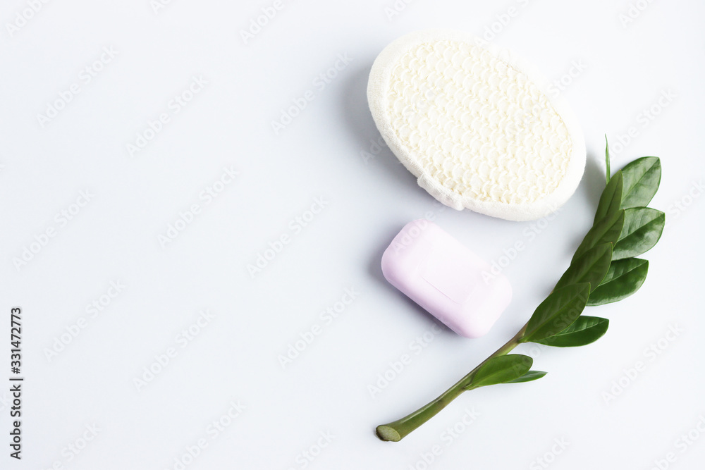 washcloth, soap and shampoo on a white background