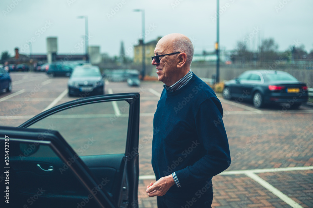 Mature man in parking lot getting into his car Stock Photo Adobe Stock