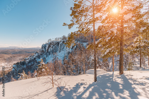 Colorful suny weather in snowy mountains landscape. Spring season concept