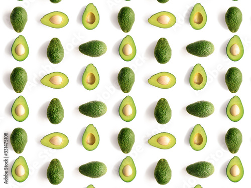 green avocado on white background