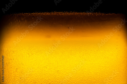 Water drops on glass of beer. Close up beer background.