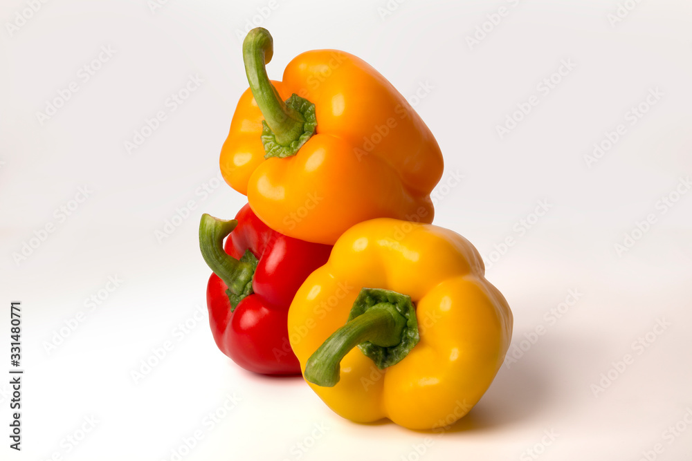 colorful bell peppers isolated on white background