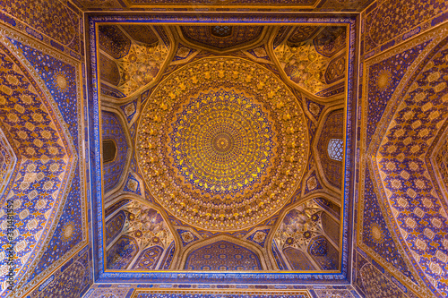The interior of the mosque in the Tilla-Kari madrasah on the Registan square  the dome  the ceiling. Samarkand  Uzbekistan
