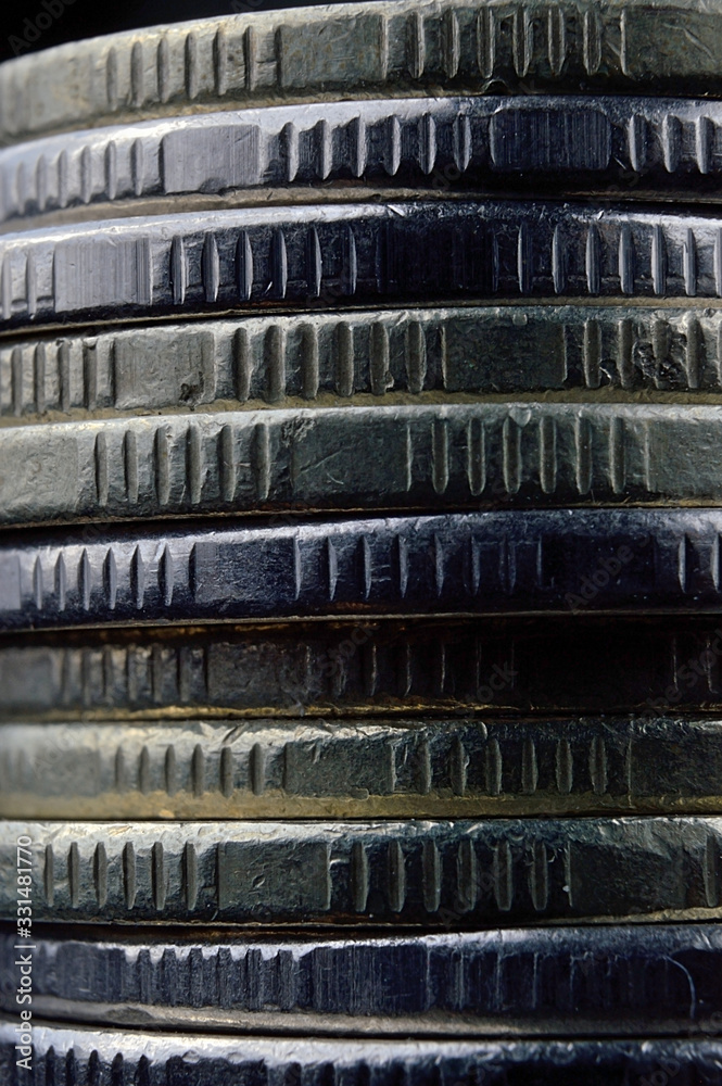 Closeup of coins stack isolated on black background Closeup of coins stack isolated on black background