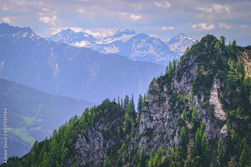 View over the Austrian Alps in summer, snowy peaks in the background