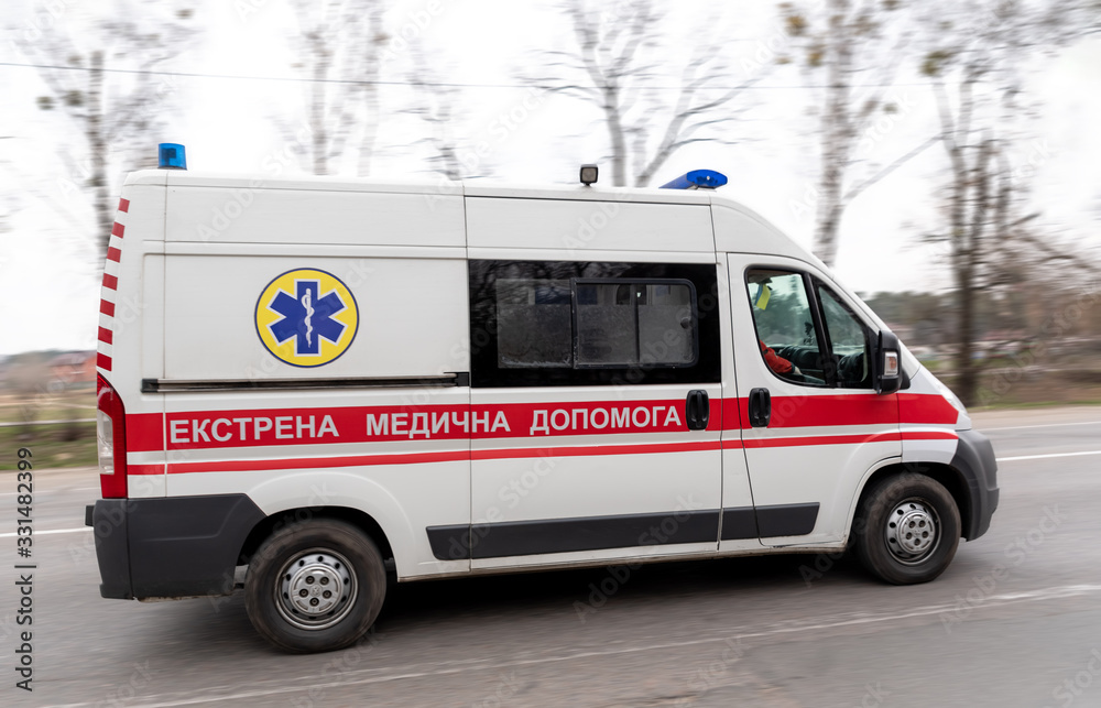 Ukrainian ambulance on emergency car in motion blur