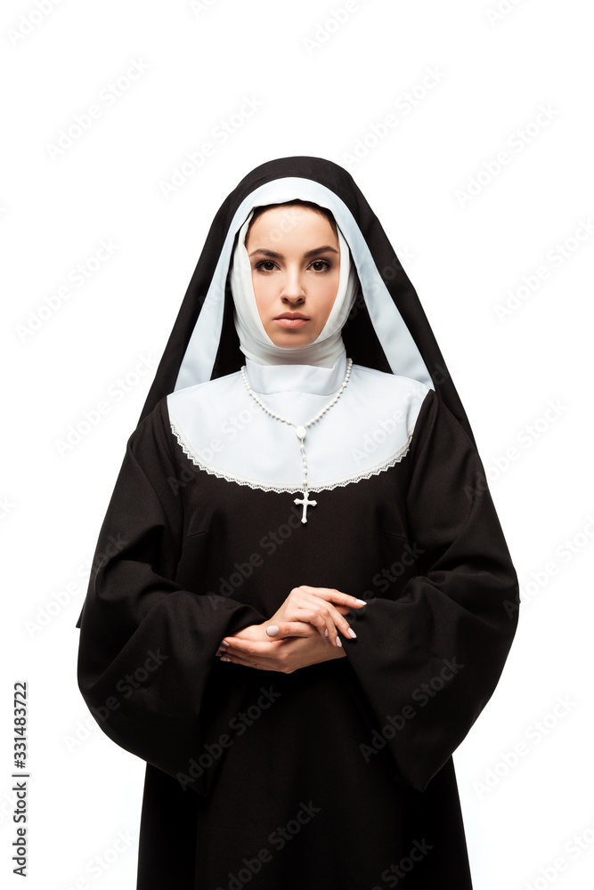 beautiful serious nun in black clothing, isolated on white beautiful serious nun in black clothing, isolated on white