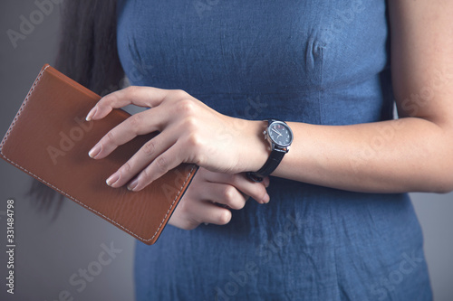 woman hand notepad with watch