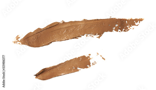 Cosmetic concealer smear strokes isolated on white background, tone cream smudged Corrector texture. Make Up.