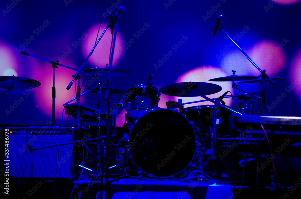 Musical drum kit and stage microphones.