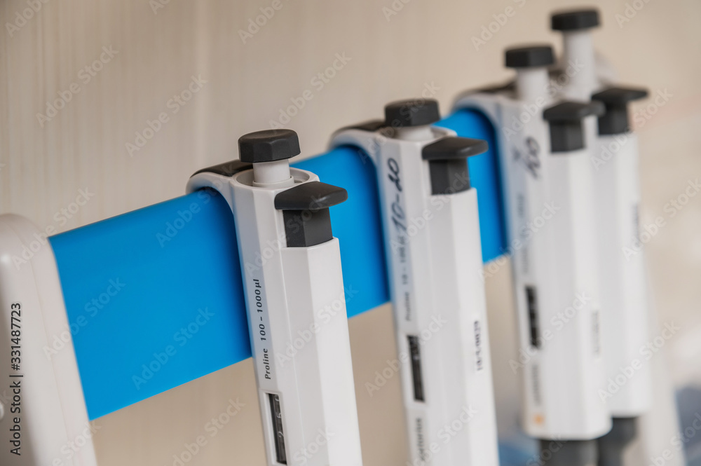 Set of automatic pipettes on a stand