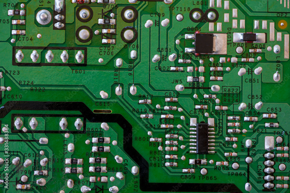 Close-up of electronic components. SMD resistors, capacitors, inductors and integrated circuits. Close-up of electronic components. SMD resistors, capacitors, inductors and integrated circuits.