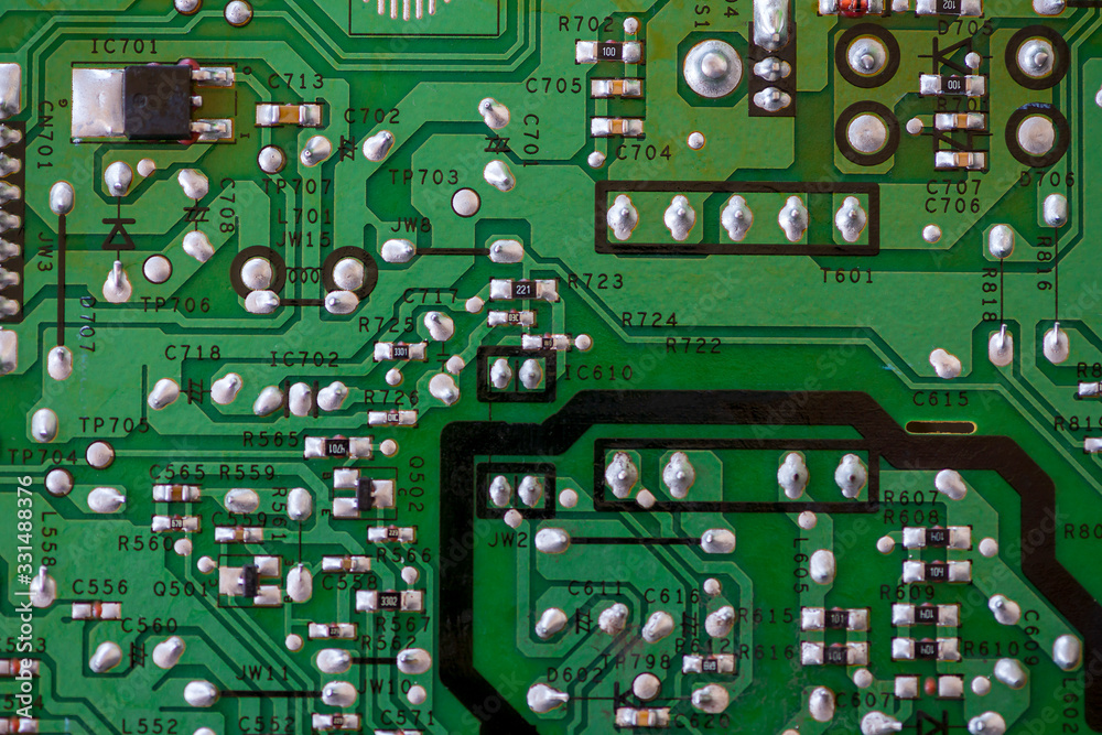 Close-up of electronic components. SMD resistors, capacitors, inductors and integrated circuits. Close-up of electronic components. SMD resistors, capacitors, inductors and integrated circuits.