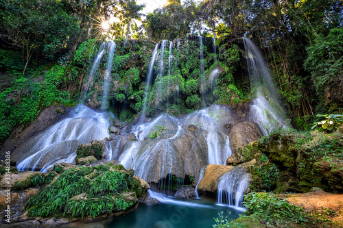 El Nicho Waterfalls in Cuba. El Nicho is located inside the Gran Parque Natural Topes de Collantes a forested park that extends across the Sierra Escambray mountain range in central Cuba. photo