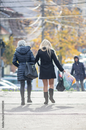 People walking on the street. Real people.