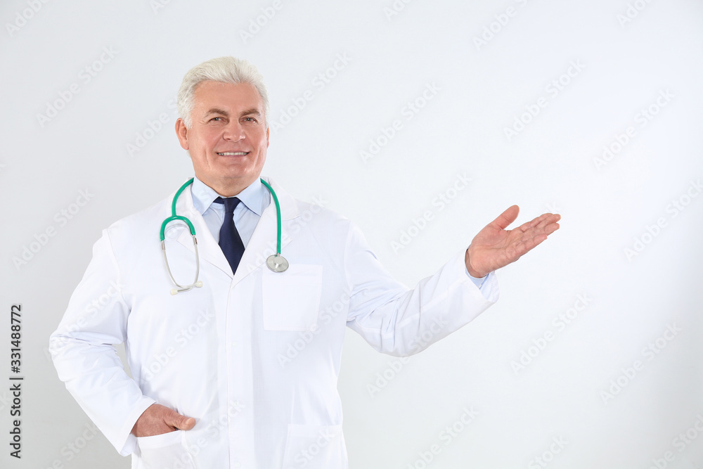 Portrait of senior doctor with stethoscope on white background Portrait of senior doctor with stethoscope on white background