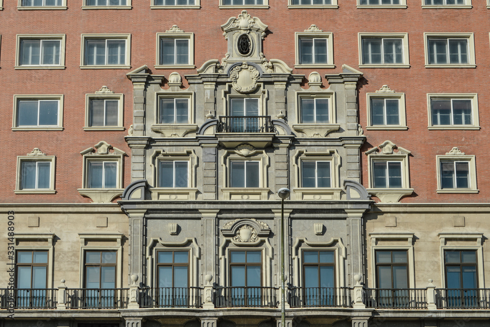 balconies and windows of the facade of the Plaza building in Madrid. Spain