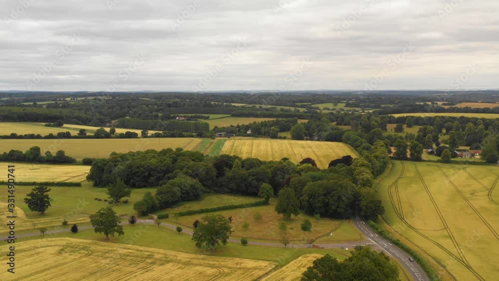 4K Aerial view of British countryside with wheat fields