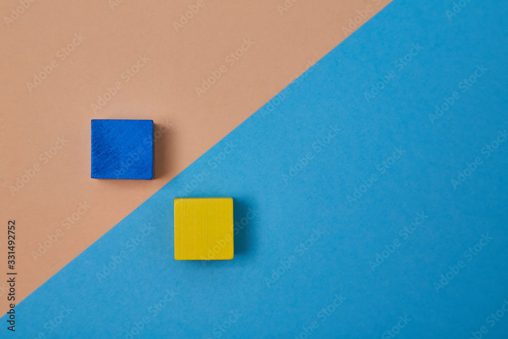 Wooden cubes mockup with copy space for inscription design. Yellow, blue blocks nearby diagonal line, place for text Wooden cubes mockup with copy space for inscription design. Yellow, blue blocks nearby diagonal line, place for text