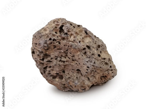 Basait stone isolated on white background. Basalt is a dark-colored, fine-grained, igneous rock composed mainly of plagioclase and pyroxene minerals. It most commonly forms as an extrusive rock,