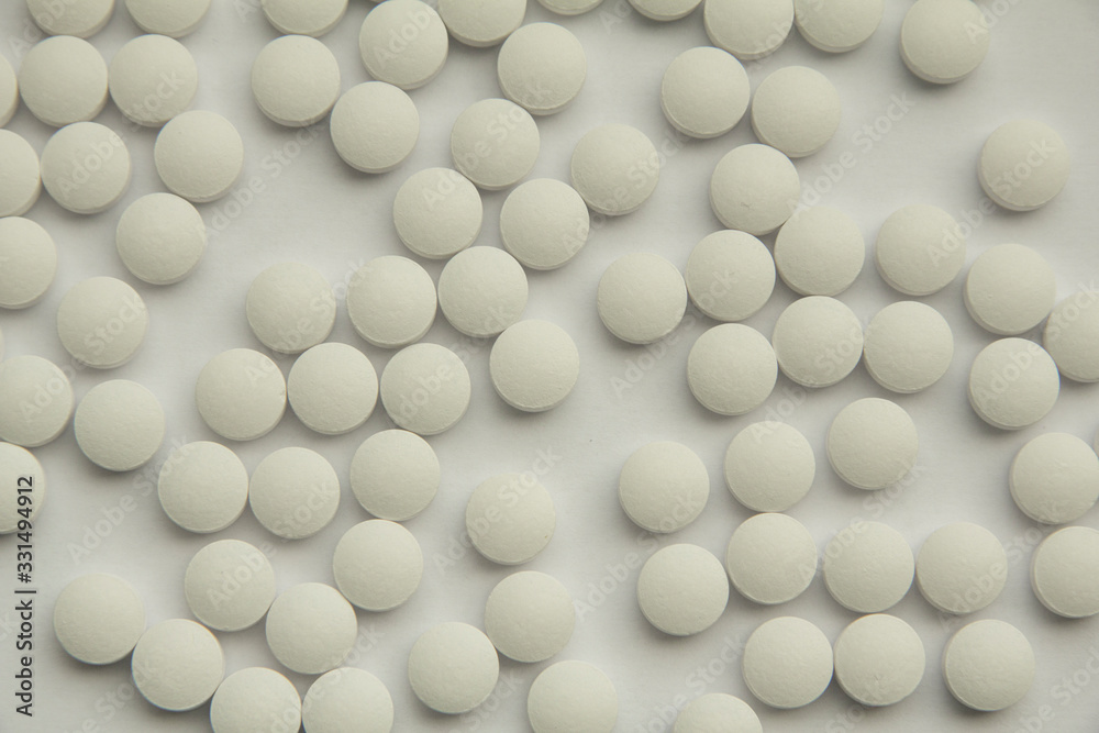 white pills background white pills background