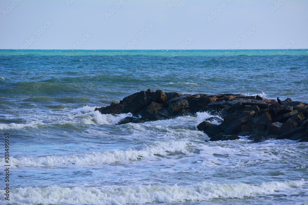 Waves breaking on the rocks of the coast. Waves breaking on the rocks of the coast.
