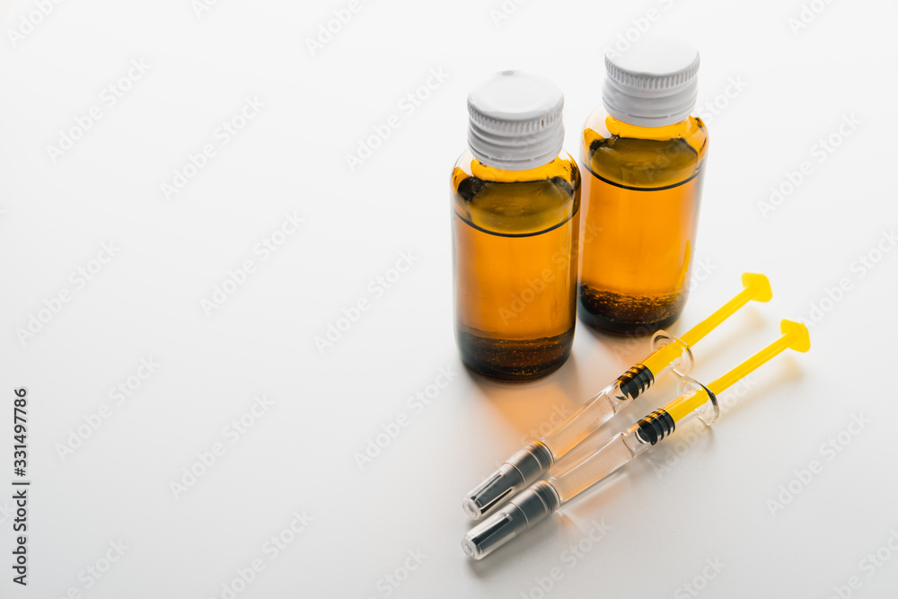 Coronavirus Vaccine, Corona virus Vaccine concept with syringe and.antidote on white background. Vaccine Concept of fight against coronavirus. Coronavirus Vaccine, Corona virus Vaccine concept with syringe and.antidote on white background. Vaccine Concept of fight against coronavirus.