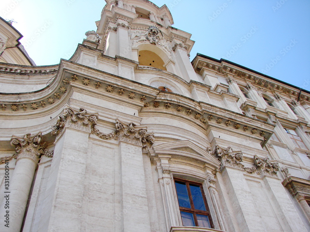 Architectural beauty and sculptural sophistication of white Catholic cathedrals in the aura of sunshine.
