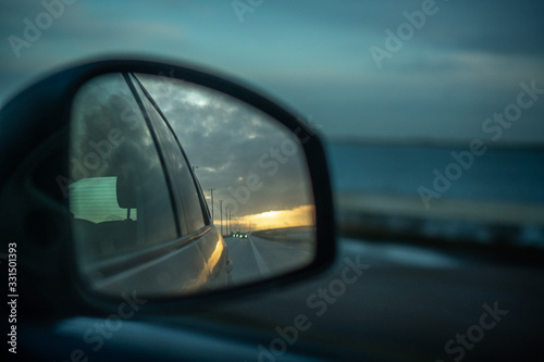 rear view mirror and reflection of road © Joan