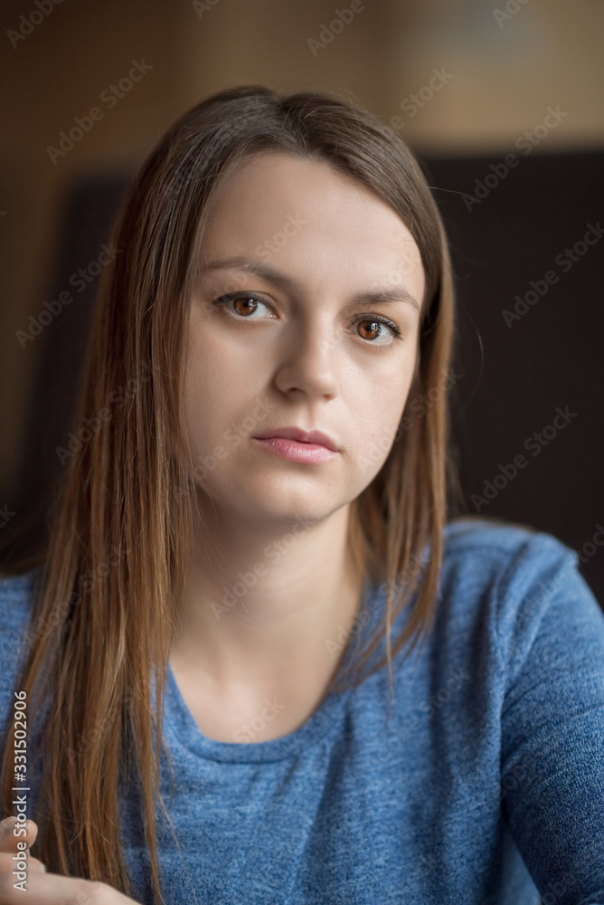 Portrait of a young girl in a cafe. Photographed close-up. Portrait of a young girl in a cafe. Photographed close-up.