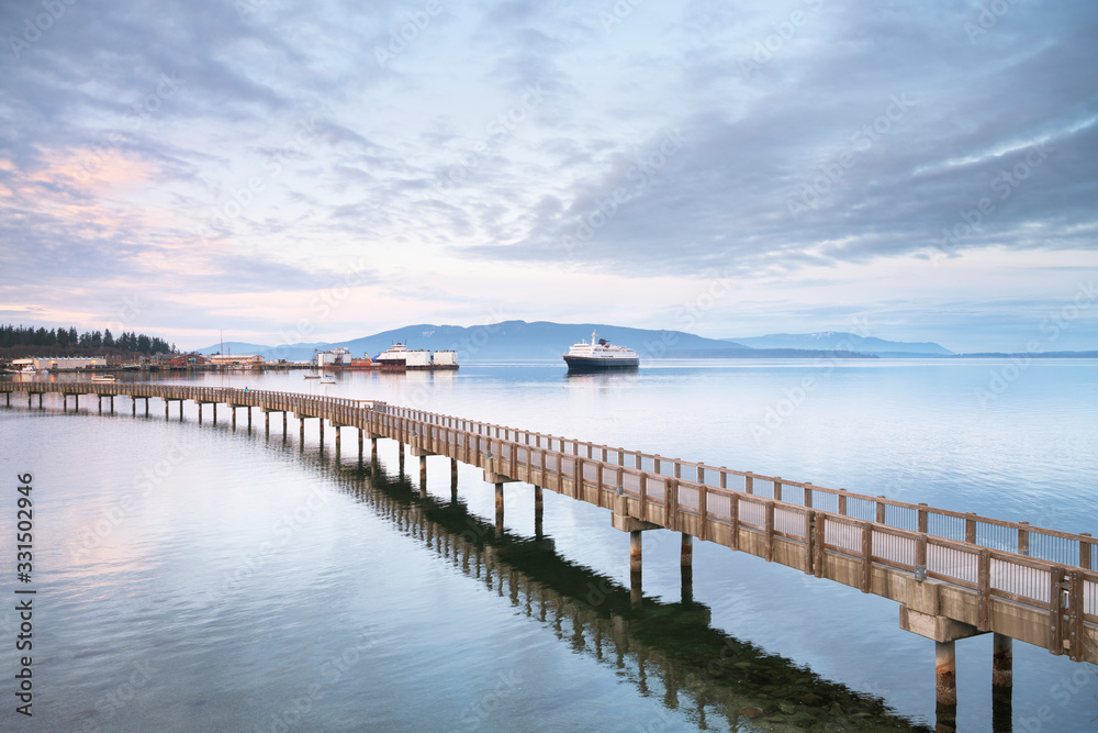 Alaska Ferry approaching dock in Bellingham Bay. from Boulevard Park Boardwalk. Bellingham Washington. Bellingham. Washington. United States Alaska Ferry approaching dock in Bellingham Bay. from Boulevard Park Boardwalk. Bellingham Washington. Bellingham. Washington. United States