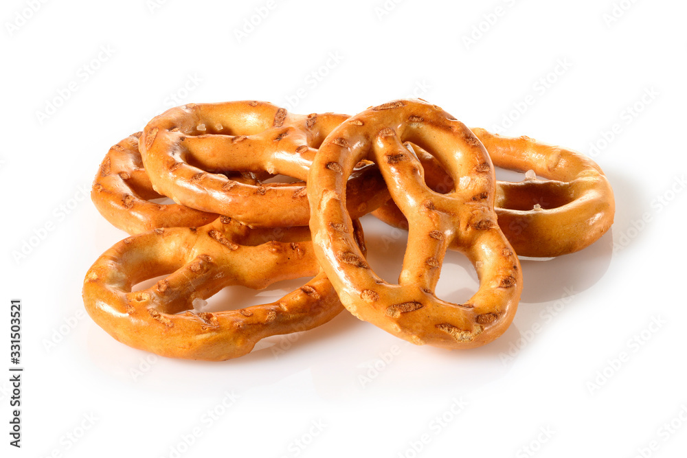 Pretzels, four mini snacks with salt for beer. Savory backed beer snack. Macro close-up isolated on white background, side view Pretzels, four mini snacks with salt for beer. Savory backed beer snack. Macro close-up isolated on white background, side view
