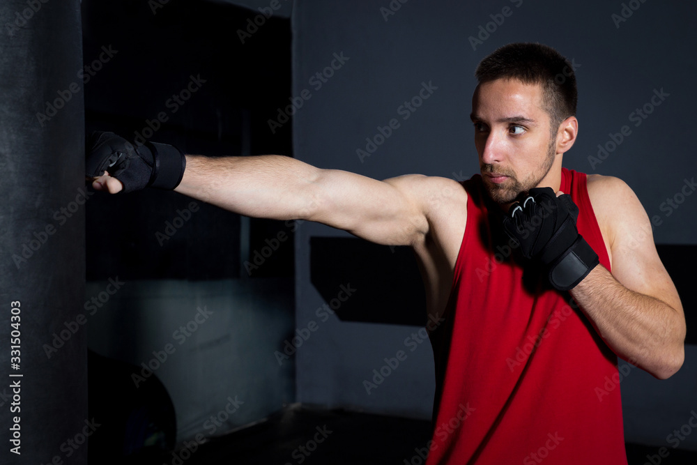 Man  Punching A Boxing Bag