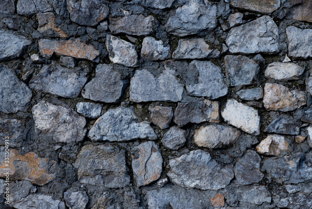 Texture of stone wall made of grey stones Texture of stone wall made of grey stones