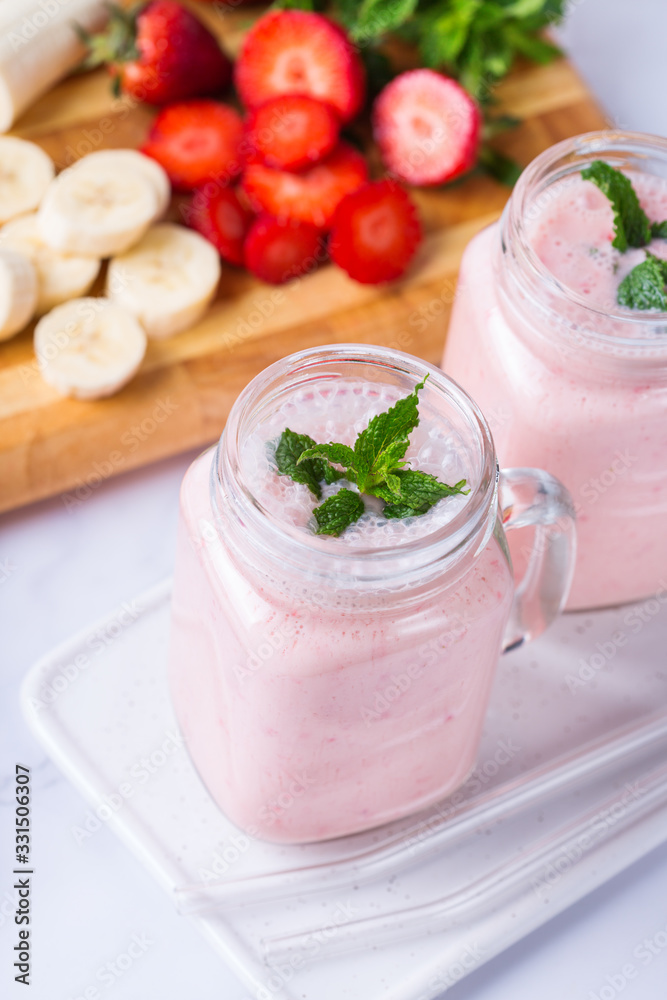 Pink smoothie with banana and strawberry for healthy, vegan diet Pink smoothie with banana and strawberry for healthy, vegan diet