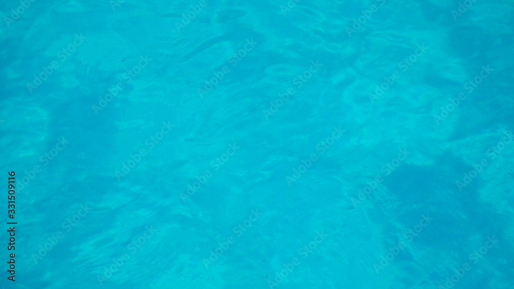 swimming pool with flow water wave and bottom surface texture and see top view using for background or banner summer concept.