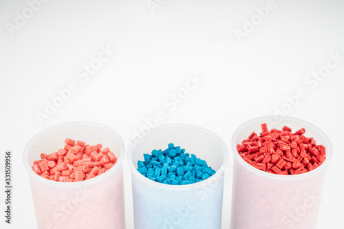 Plastic granules close up for holding,Colorful plastic granules with white background. and dollar money,Plastic Business,Plastic industry.