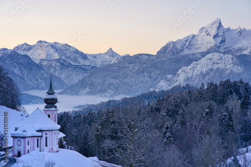 The church in Maria Gern in Bavaria, Germany in the winter with mountains in the background